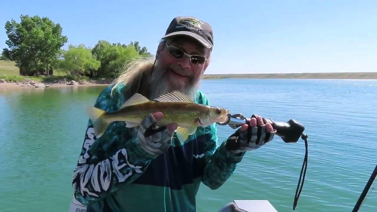 Jim holding a fish during the first fishing trip of the year